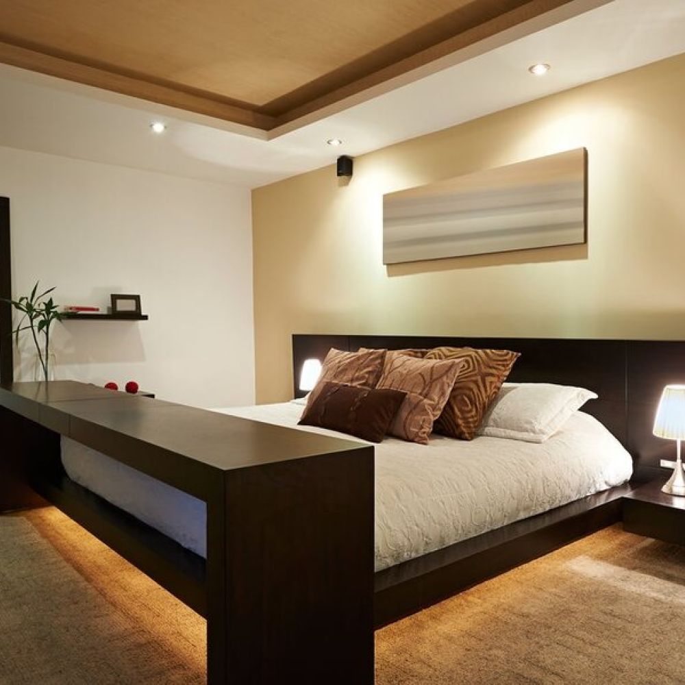 <span class="uk-h4">A bedroom illuminated by various smart lighting fixtures.</span>
